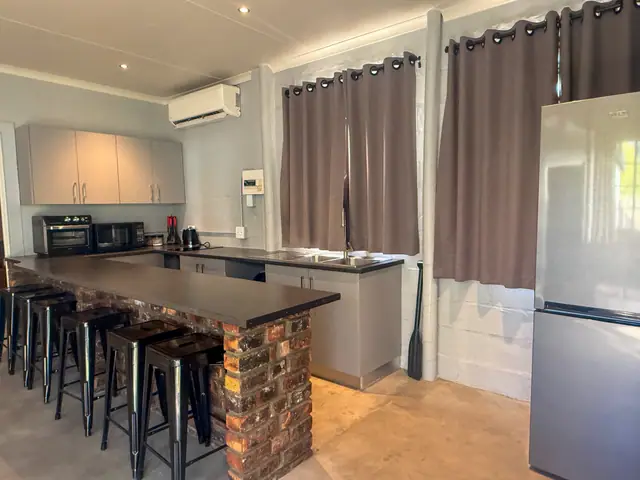 Open kitchen and the brick bar counter