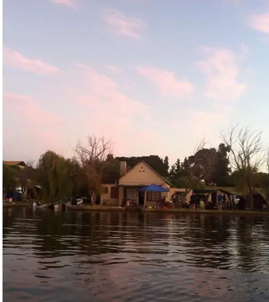 The houses at dusk, seen from the water